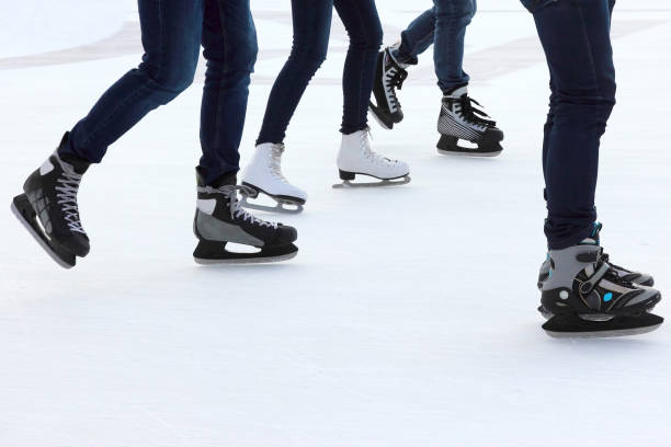 istock foot ice-skating people on the ice rink 903442800