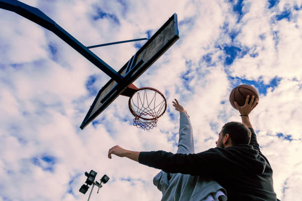 istock Two basketball players playing a friendly game 903449942