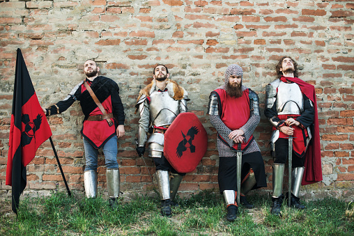 Medieval aristocracy, dukes, nobles, knights and peasants in small Northern European village, proudly showing their culture, tradition and battle strength. Soldiers are under princess' command and ready to protect the land