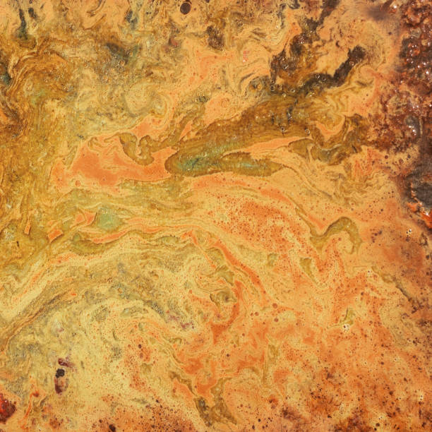 istock An unusual background with orange and red divorces. Blots and stains. 903456640