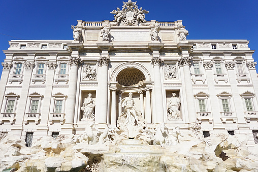 An upclose view of the historical Trevi Fountain in Rome Italy.