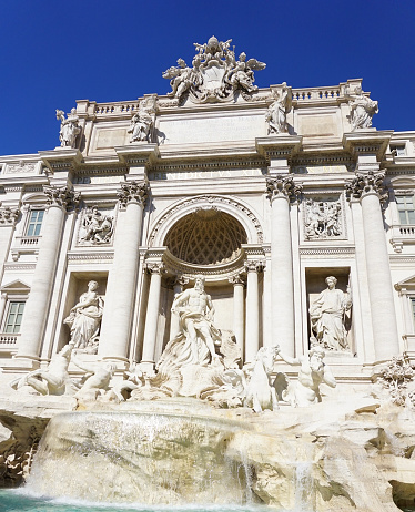 An upclose view of the historical Trevi Fountain in Rome Italy.