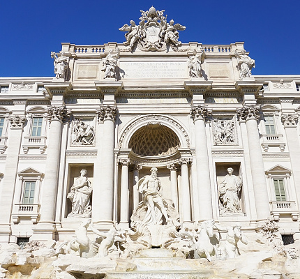 An upclose view of the historical Trevi Fountain in Rome Italy.
