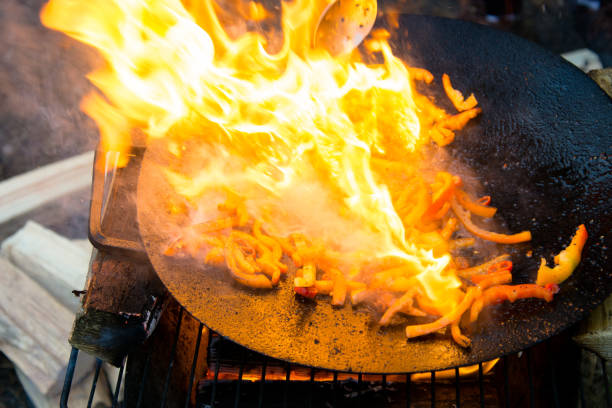 istock Grilled roasted bell peppers on a hot frying pan on open fire 903460592