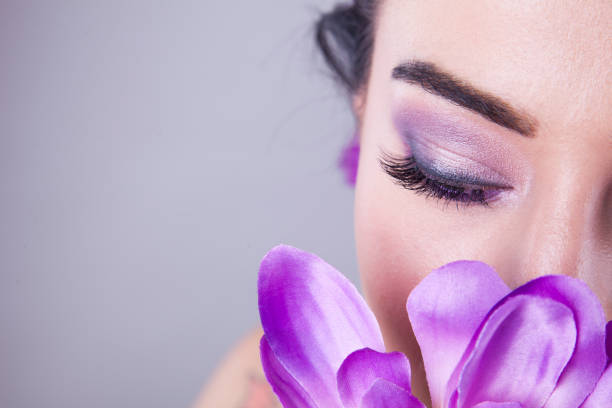 istock Make up trendy. Beauty shooting with purple flower. 903468688