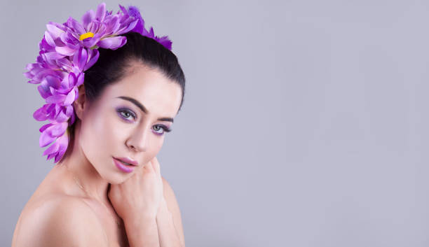 istock Make up trendy. Beauty shooting with purple flower. 903468696