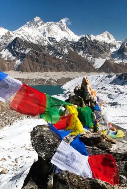 view of Mount Everest and Lhotse with buddhist prayer flags from Gokyo Ri - way to Everest base camp, Sagarmatha national park, Khumbu valley, Solukhumbu, Nepal Himalayas