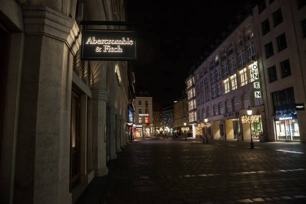Abercrombie & Fitch logo on their Munich main shop taken at night. Abercrombie & Fitch is American retailer specialized in Youth wear Picture of the Munich Abercrombie & Fitch shop at night. Abercrombie & Fitch is an American retailer that focuses on upscale casual wear for young consumers abercrombie fitch stock pictures, royalty-free photos & images