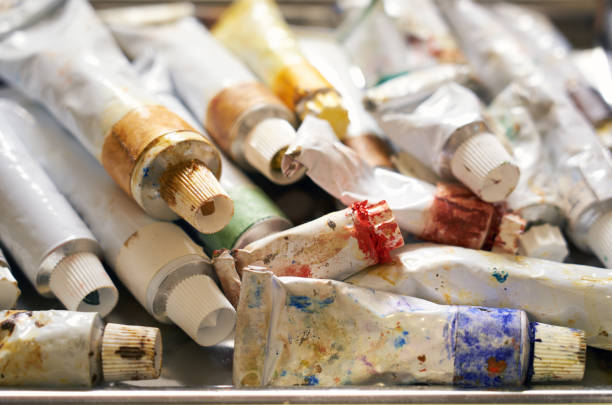 Lots of oil paint tubes on a table