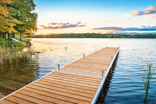 Stock photograph of a pier at Bala, Lake Muskoka, Ontario, Canada on a clear blue sky day.