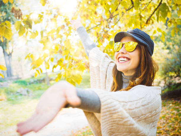 Young woman enjoing autumn stock photo