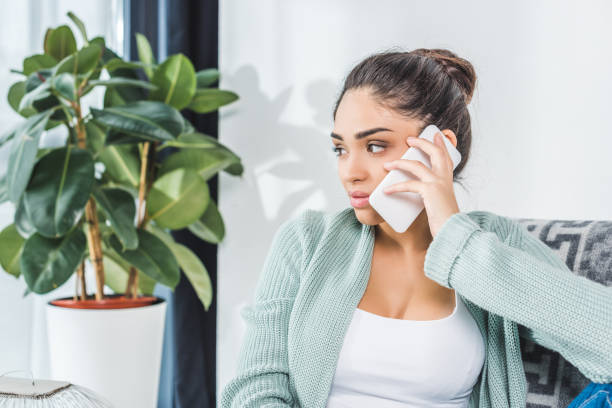istock girl using smartphone at home 903482698