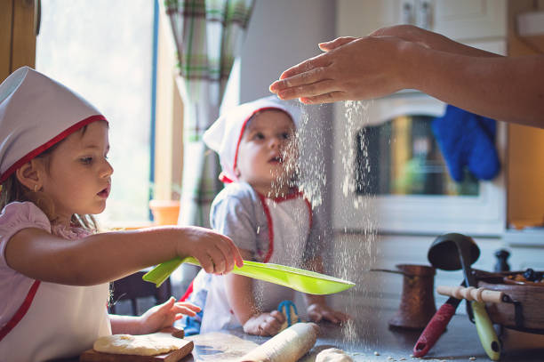 istock Young family cooking in kitchen 903482928