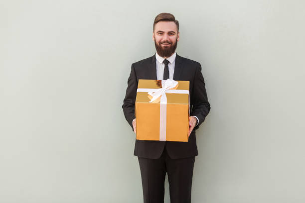 istock It's gift box for you! Success banker gives a gift 903486080
