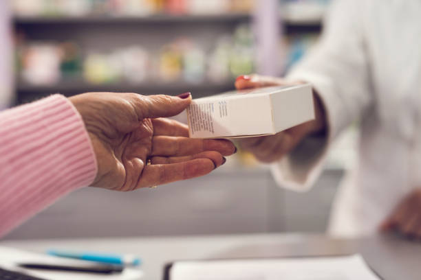 istock Close up human hands holding medicine box 903486408
