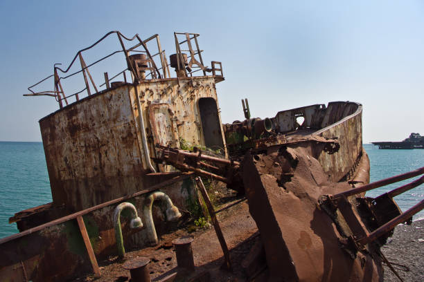 istock Rusty abandoned shipwreck on the beach in Sukhum, Abkhazia 903491560