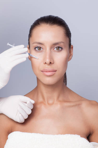 istock Needle mesotherapy. Beautiful woman in the spa. 903494076