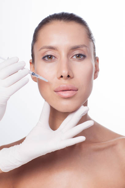istock Needle mesotherapy. Beautiful woman in the spa. 903494078