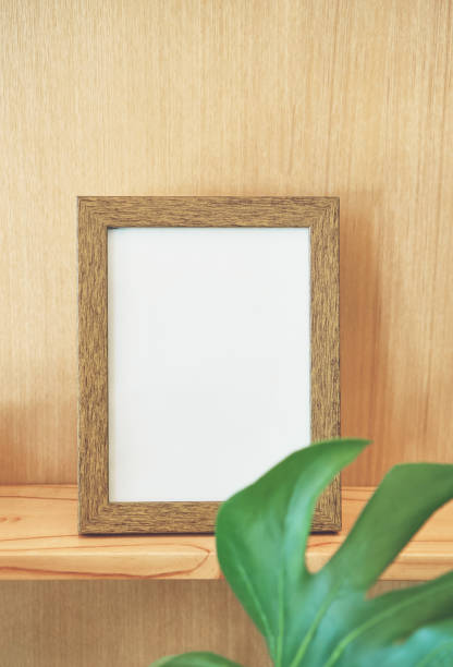 istock Empty wooden frame rests on the wall of the wall. natural pattern for beautiful wallpapers. Suitable for use an luxurious background. Vintage tone 903494724