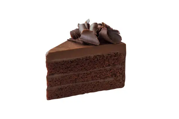 Photo of Triangle shape slice piece of chocolate fudge cake decorated with chocolate curl on white isolated and clipping paths. Delicious and soft, sweet and bitter. Homemade bakery concept.