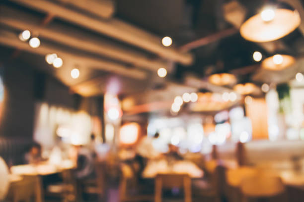 istock Restaurant cafe or coffee shop interior with people abstract blur background 903495032