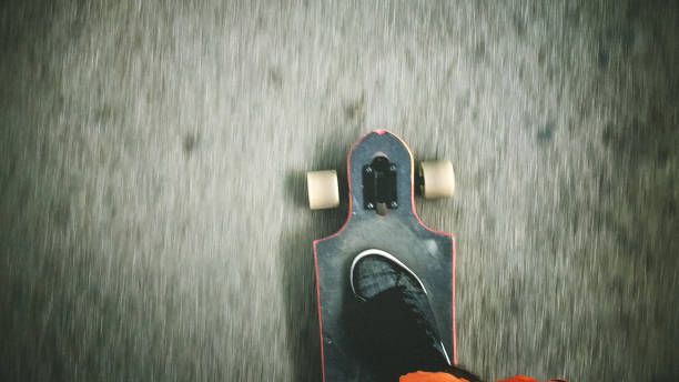 istock Longboarder driving on the street 903495034
