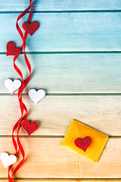 istock Small letter on a  wooden background.Valentine love heart conception 903495042