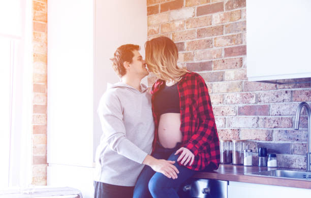 istock Young pregnant woman with partner 903495066