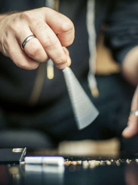 istock Preparing and rolling marijuana cannabis joint. Drugs narcotic concept 903495800