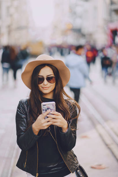 istock girl with phone in istanbul 903505254