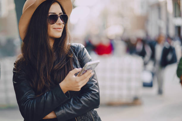 istock girl with phone in istanbul 903505272