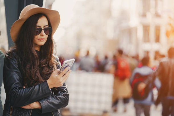 istock girl with phone in istanbul 903505332
