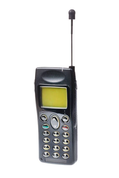 istock Old retro mobile phone with antenna isolated on white background. 903505834