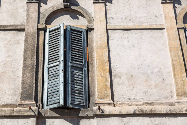 istock Typical italian window with grey wall close up. Free space for your text 903505898