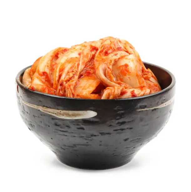 Kimchi in a   bowl isolated isolated on white background