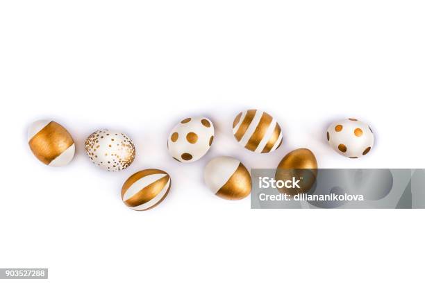 Top View Of Easter Eggs Colored With Golden Paint In Differen Patterns Various Striped And Dotted Designs White Background Copy Space Stock Photo - Download Image Now