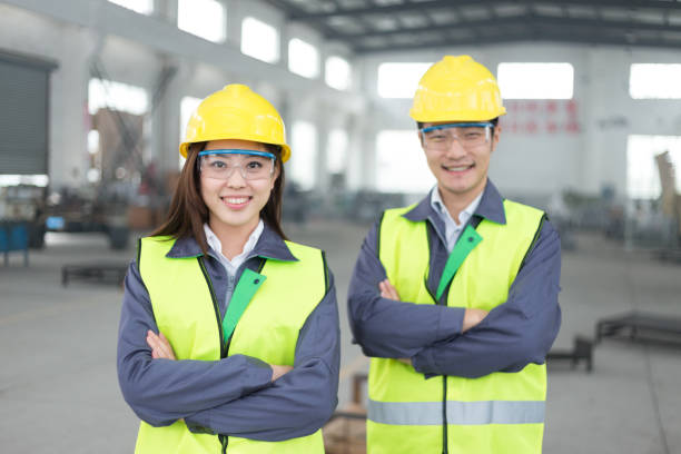 young chinese man and woman work in motor manufacturing factory