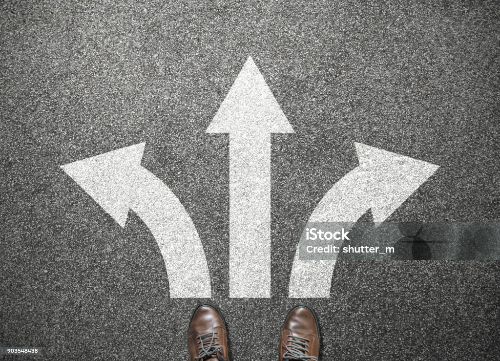 businessman shoes stand at junction, choose way to success Footpath Stock Photo