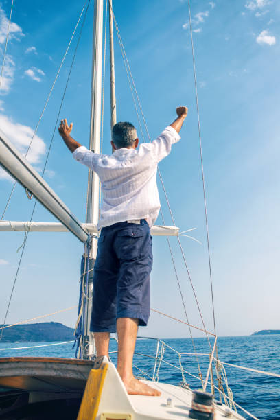 istock Man enjoying sailing with sailboat 903548986