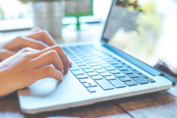 istock Woman's hand working on laptop in the office. 903549234