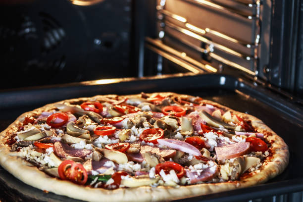istock homemade pizza with mushrooms, ham and mozzarella 903549646