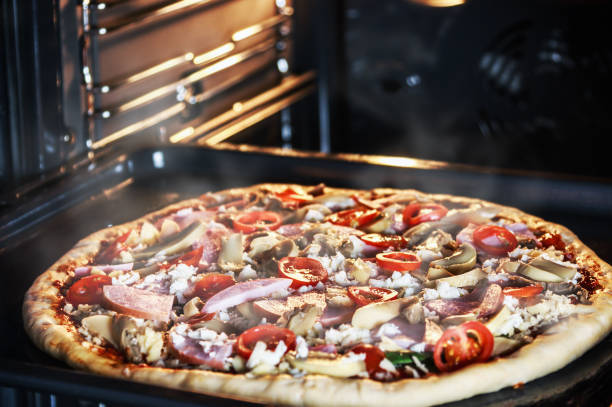 istock homemade pizza with mushrooms, ham and mozzarella 903549668