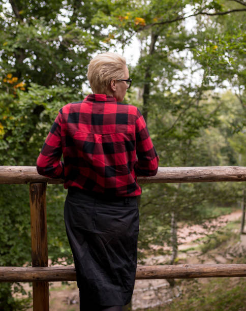 istock woman sitting on an old porch 903565340
