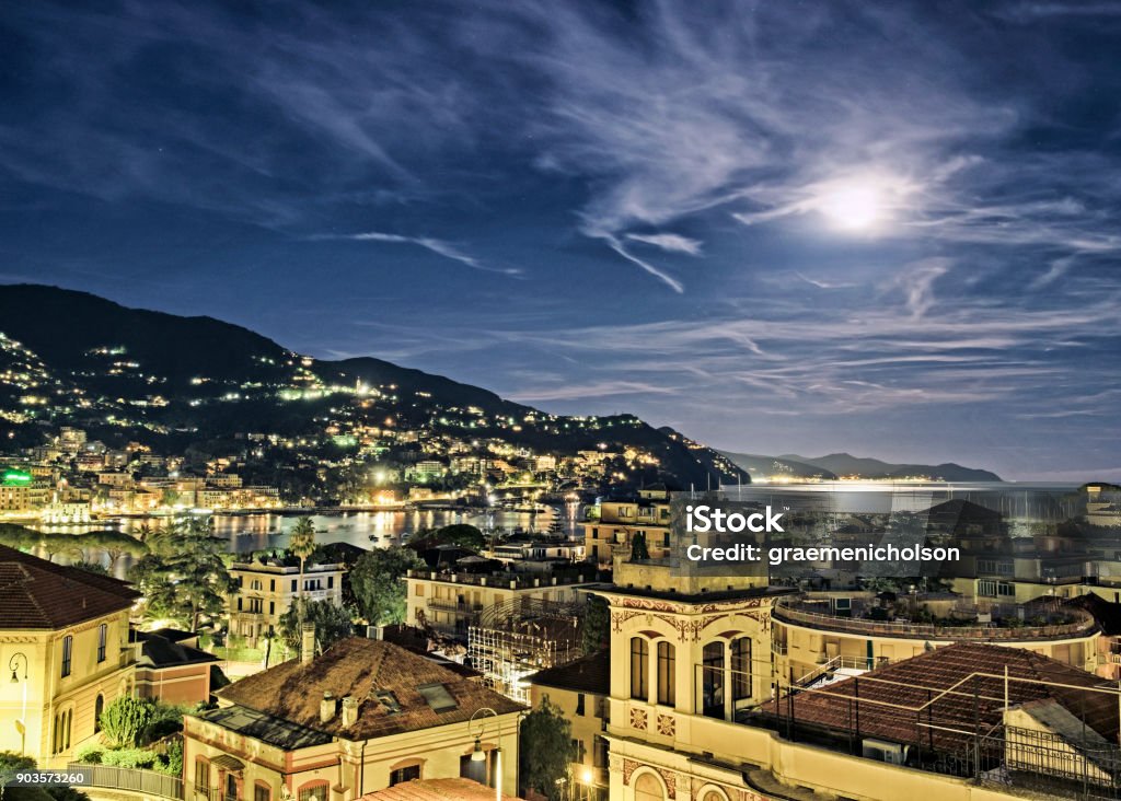 Rapallo Detail of Rapallo, Italy at night with full moon. Architecture Stock Photo