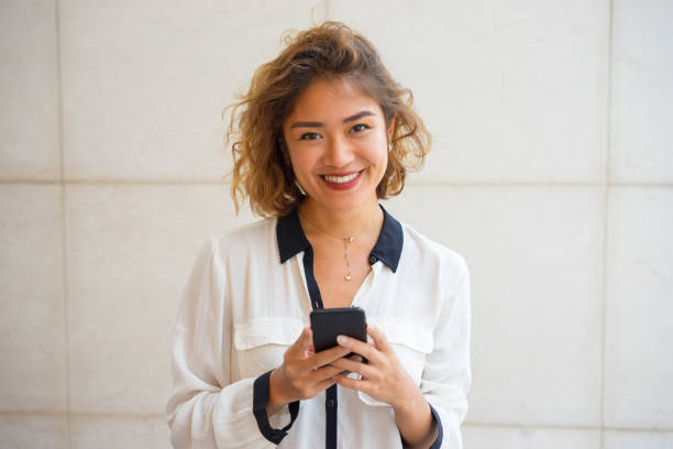 istock Joyful Asian Girl Chatting on Phone 903581292