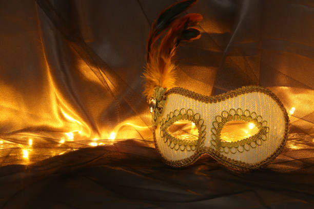 istock Image of elegant white venetian mask over tulle background. 903583744