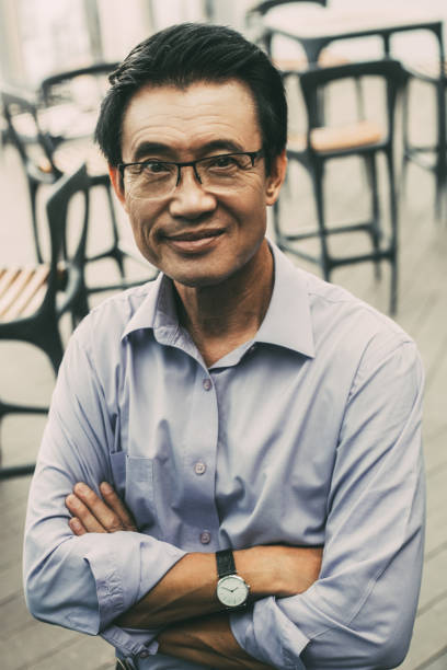 istock Closeup of Smiling Senior Man in Cafe 903584016