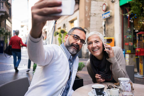 istock Couple at cafe enjoying in Italian coffee 903584362