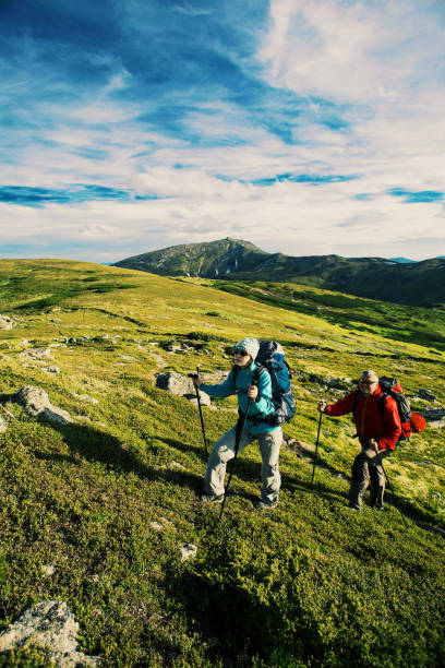 istock Summer hike in the mountains with a backpack and tent. 903584506