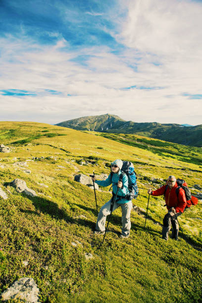 istock Summer hike in the mountains with a backpack and tent. 903584540
